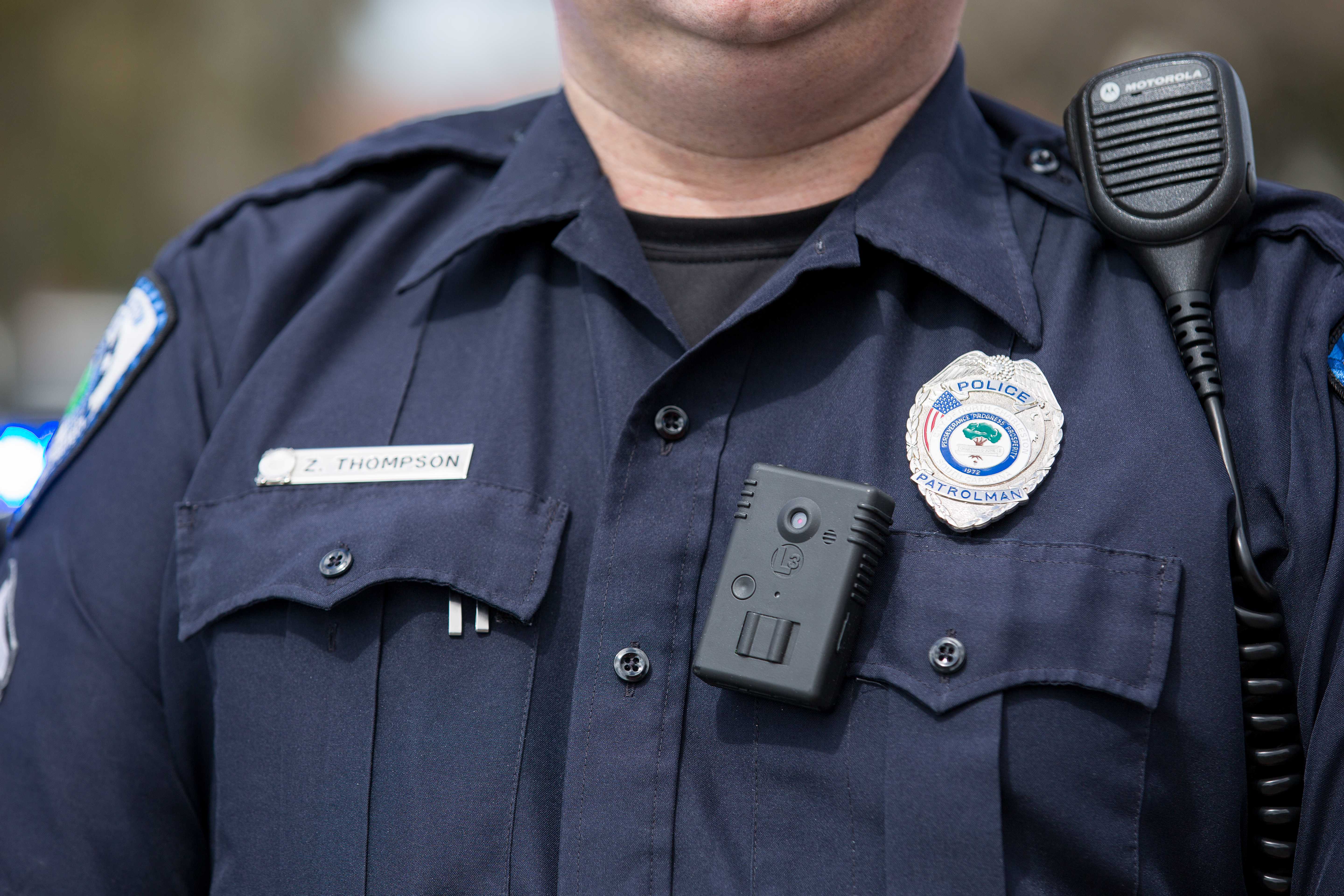 A police officer, seen with a body camera on his uniform · Photo reprinted with permission from Ryan Johnson