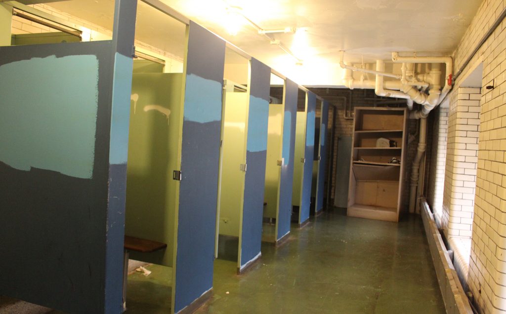 Discolored stalls in the girls locker room. Staff Photographer Bwe Ku.