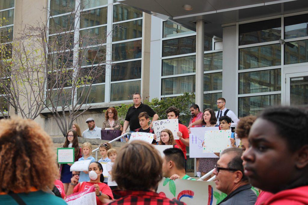 The rally was held to address the closure of Benjamin Franklin and SLA high schools due to damaged asbestos in their building.