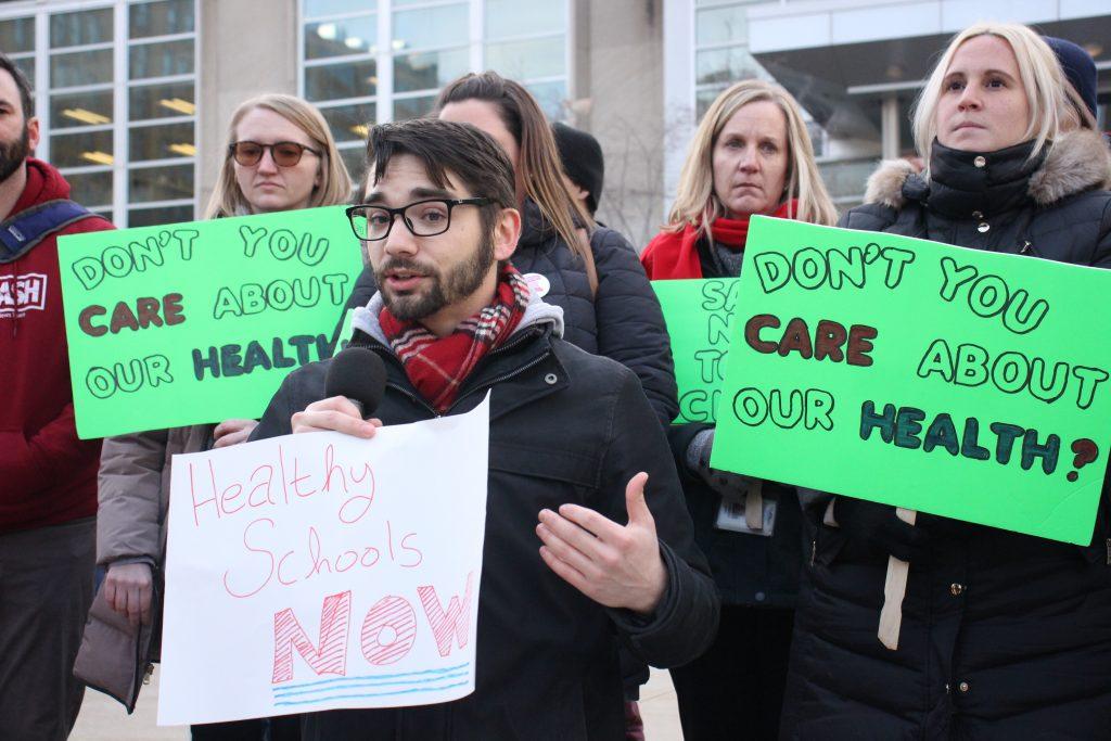 FLC Building Rep Lou Fantini addresses the crowd at the Rally for Safe Schools before the start of the January meeting of the Board of Education.