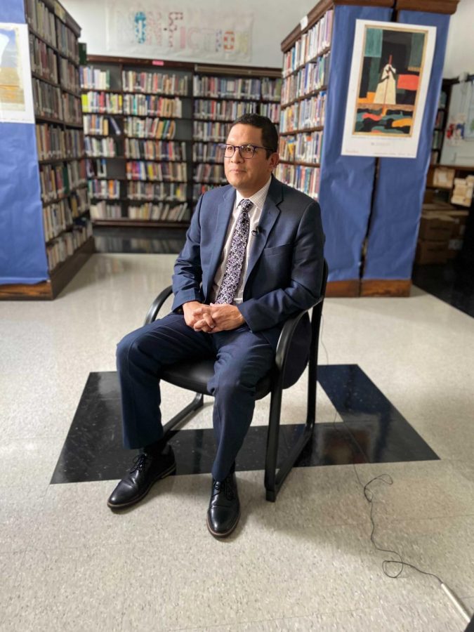 PA Secretary of Education Noe Ortega sits in FLCs library.