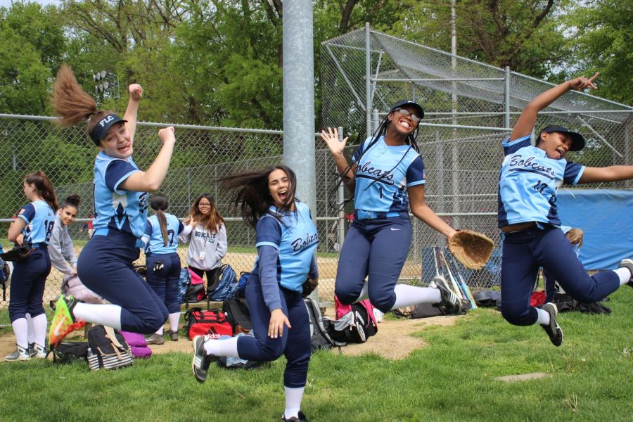 FLC’s 2019 girl’s softball players jump in excitement after an ecstatic game. 
