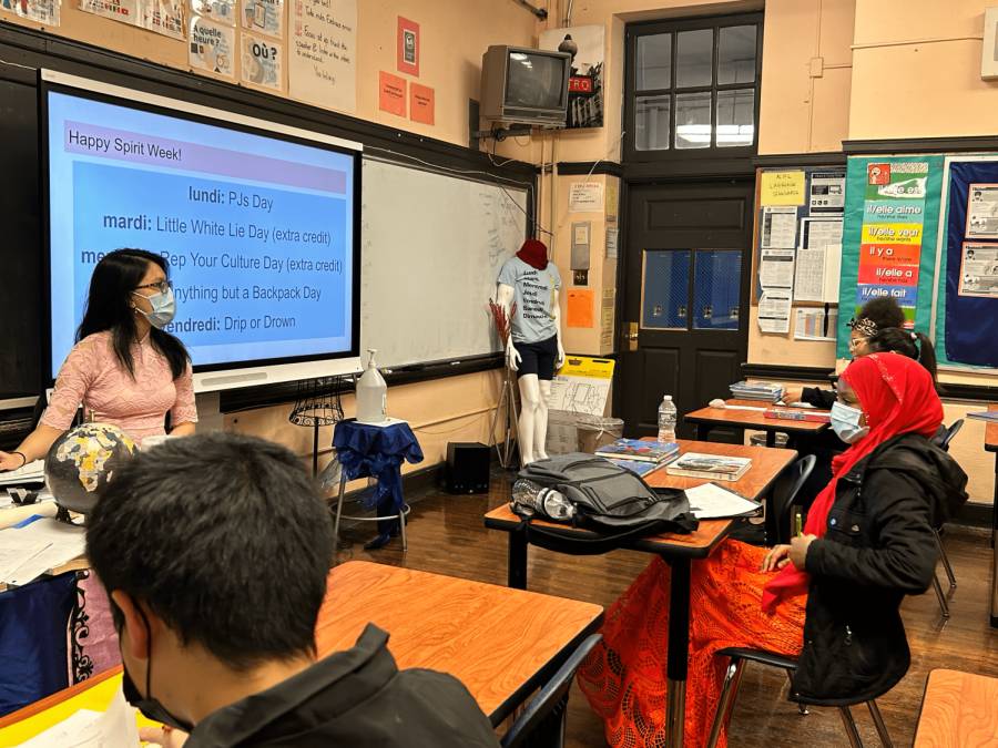 Han Nguyen presents extra credit opportunities during spirit week to her students