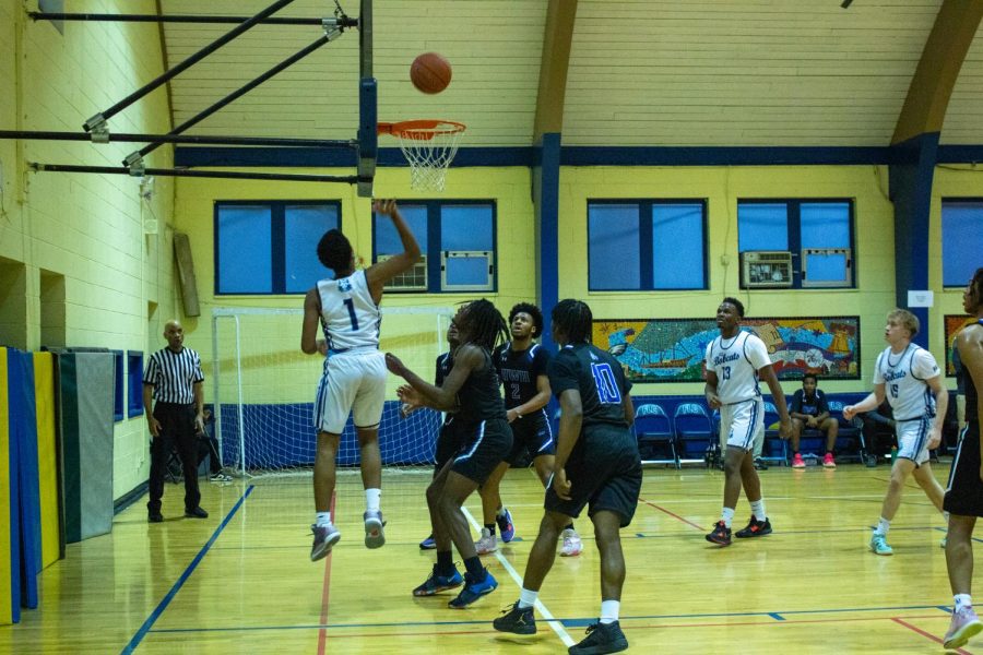 Gary Bailey (1) takes his first shot against Master Charter Hardy Williams High school. Bailey’s contributions allowed a victory for the Bobcats and the title player of the game.