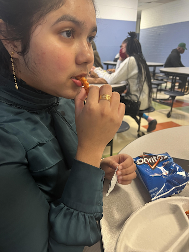 A Muslim student named Han Ni Oo is eating fries for lunch at Franklin Learning Center.